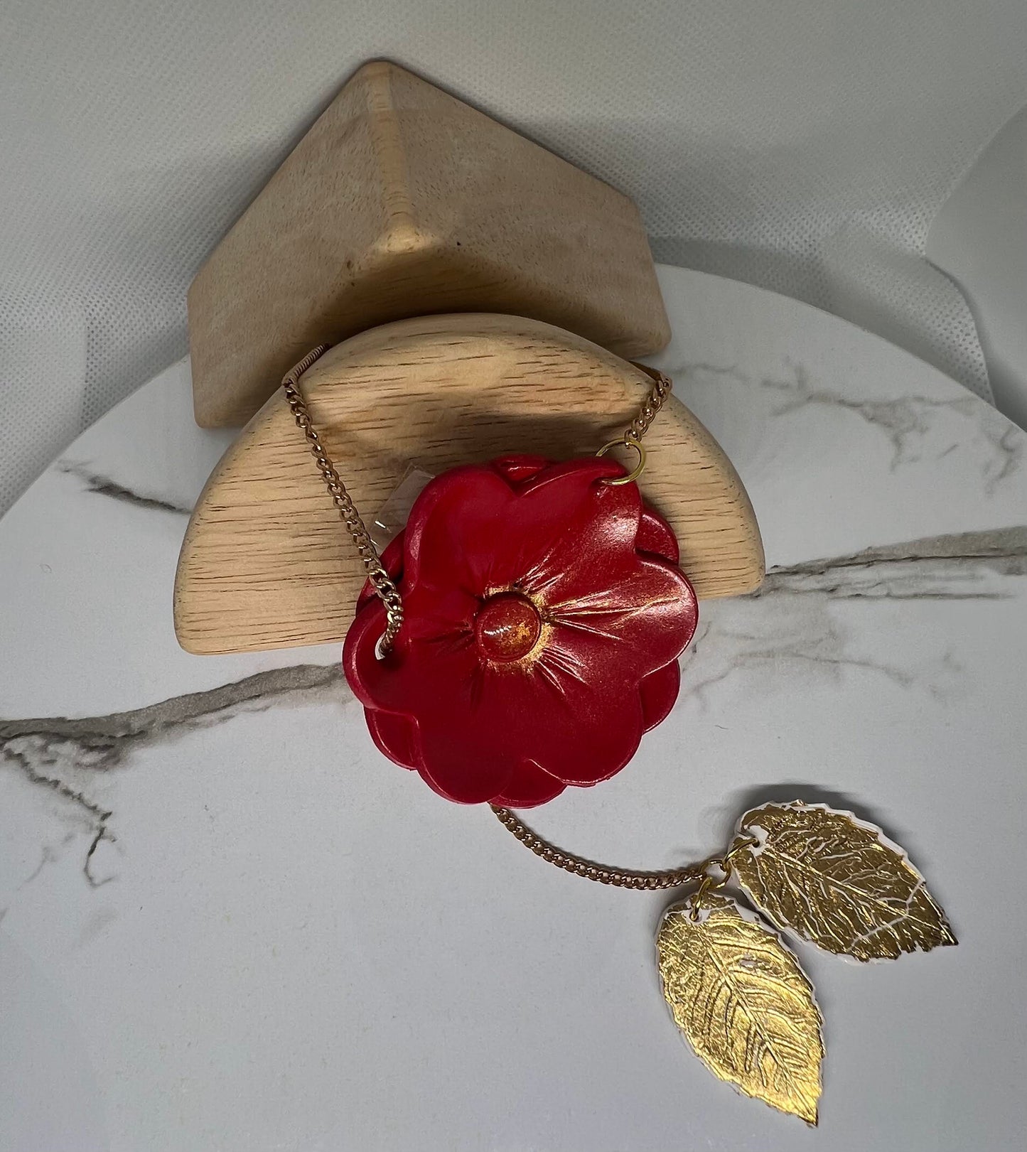 Red flower with gold leaf necklace