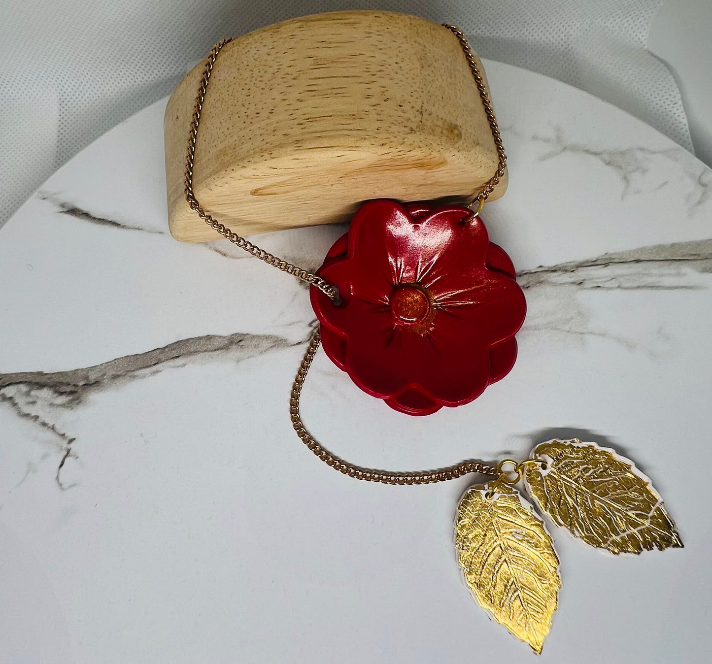 Red flower with gold leaf necklace