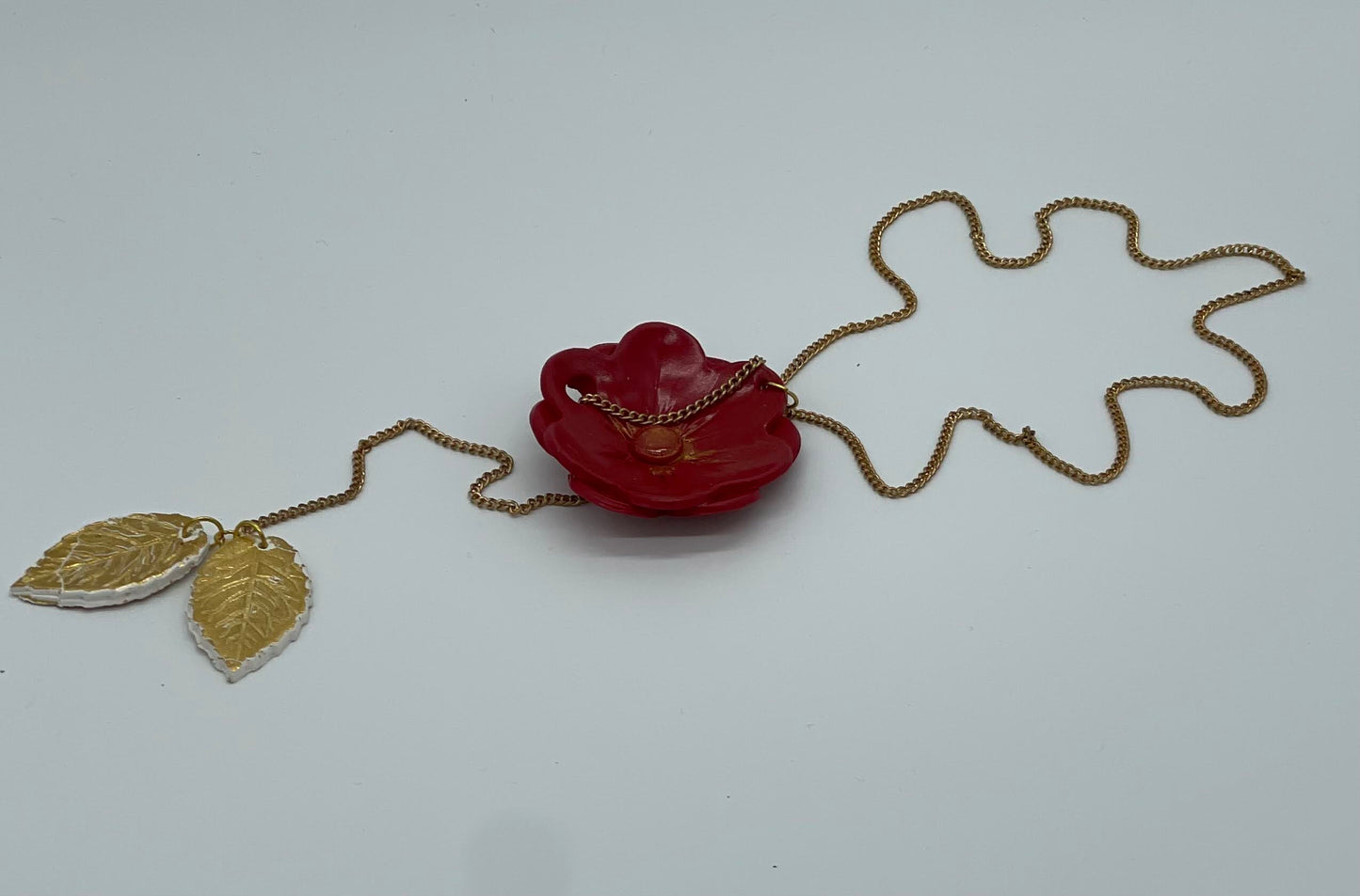 Red flower with gold leaf necklace